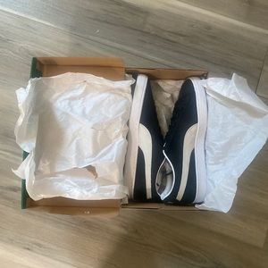 Class is white and black pumas size 9